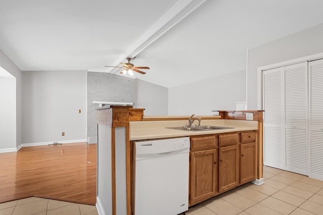 kitchen featuring white dishwasher, ceiling fan, sink, vaulted ceiling with beams, and light hardwood / wood-style floors