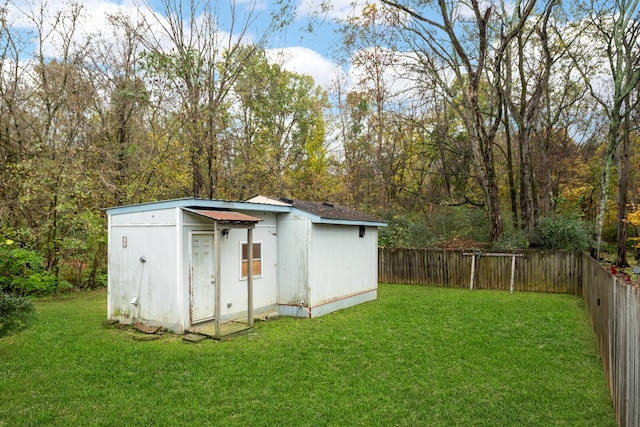 view of outbuilding featuring a lawn