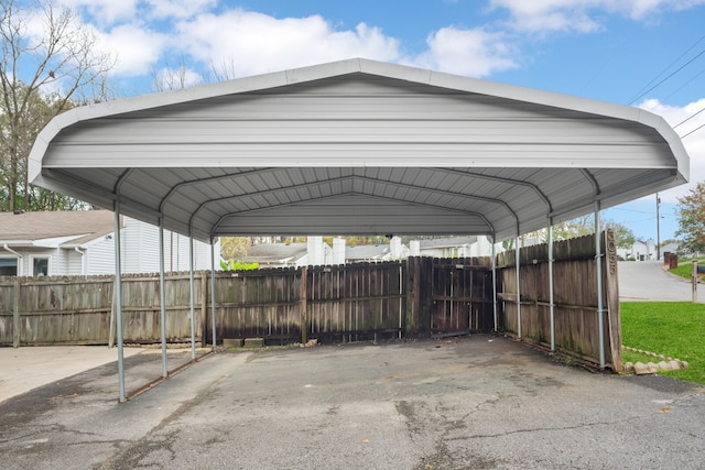 view of vehicle parking featuring a carport