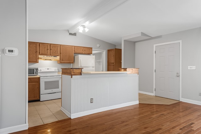 kitchen with vaulted ceiling with beams, white appliances, light hardwood / wood-style floors, and a kitchen island