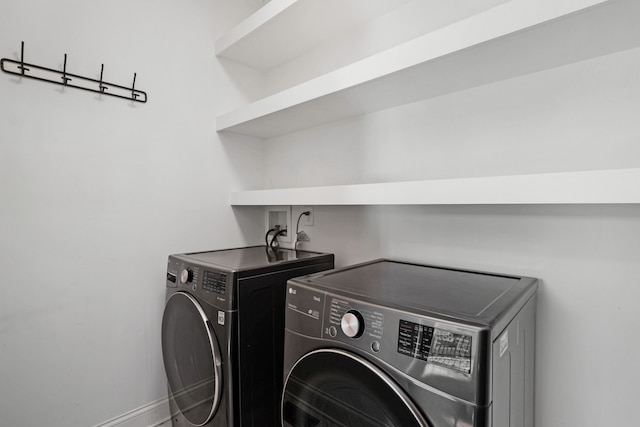 laundry room with separate washer and dryer