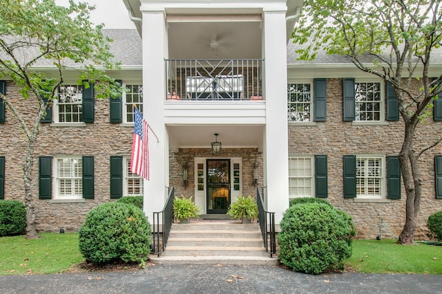 view of front of house with a balcony