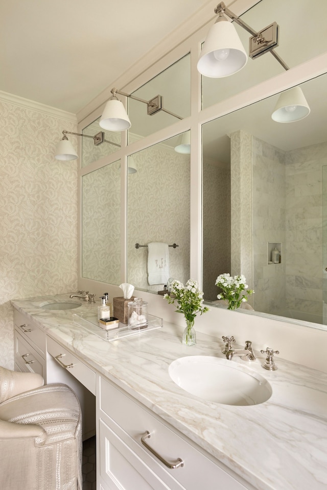 bathroom featuring crown molding, vanity, and tiled shower