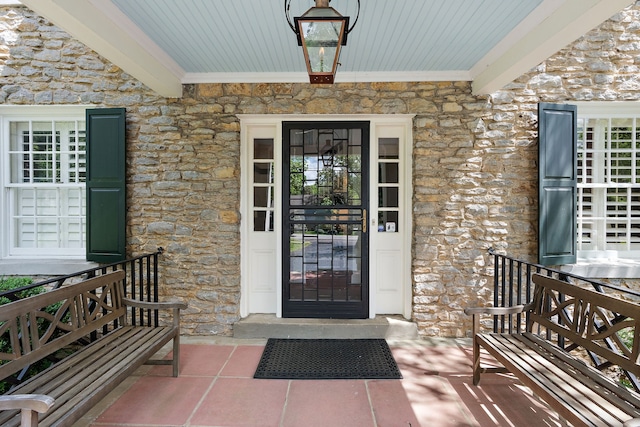 doorway to property featuring covered porch