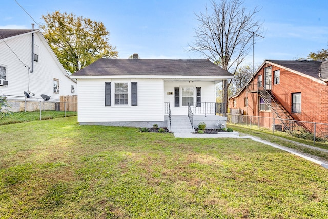 view of front of property with covered porch and a front lawn