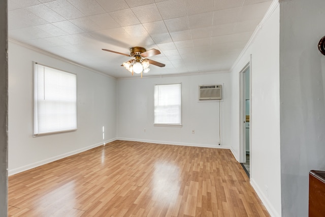 spare room featuring a wall mounted AC, crown molding, ceiling fan, and light hardwood / wood-style floors