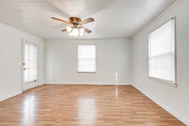 unfurnished room featuring a wealth of natural light, light hardwood / wood-style flooring, and ceiling fan