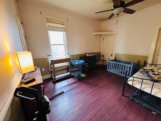 misc room featuring ceiling fan and dark hardwood / wood-style flooring