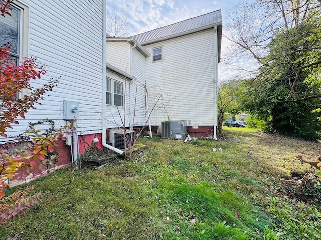 view of home's exterior with cooling unit