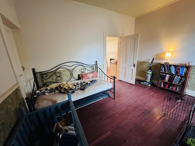 bedroom featuring dark hardwood / wood-style floors and crown molding