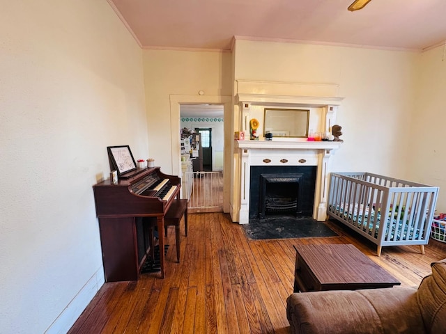 living room with hardwood / wood-style floors and ornamental molding