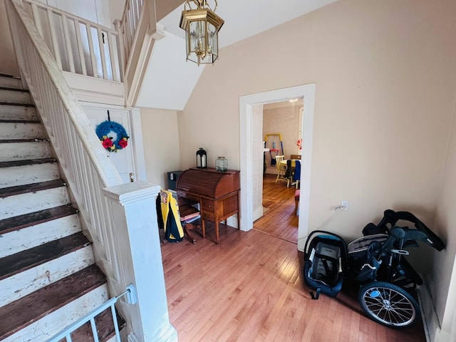 entryway with a chandelier and wood-type flooring