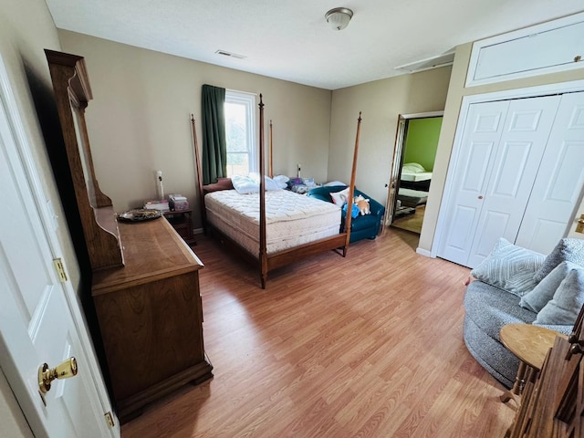 bedroom with a closet and light wood-type flooring