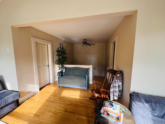 sitting room featuring light wood-type flooring and ceiling fan