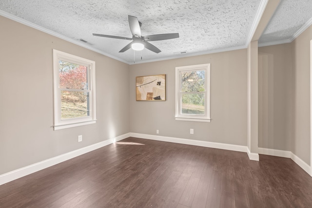 empty room with ceiling fan, crown molding, dark wood-type flooring, and a textured ceiling