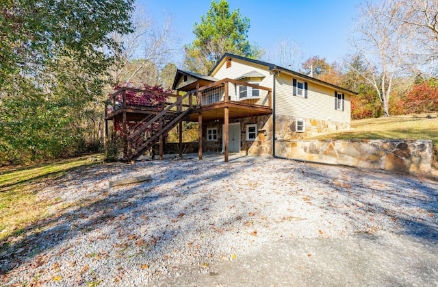 view of front of property with a wooden deck