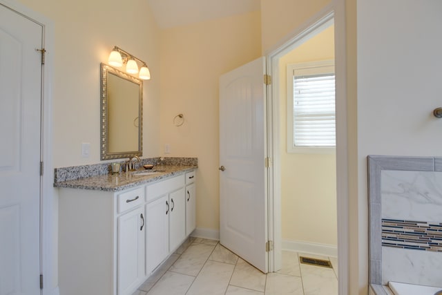 bathroom with a bath and vanity