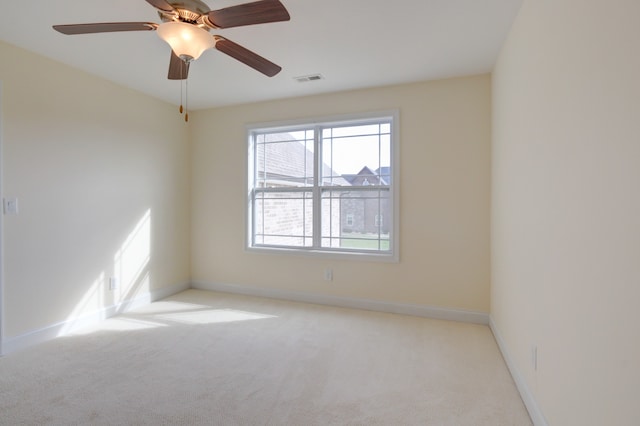 carpeted empty room with ceiling fan