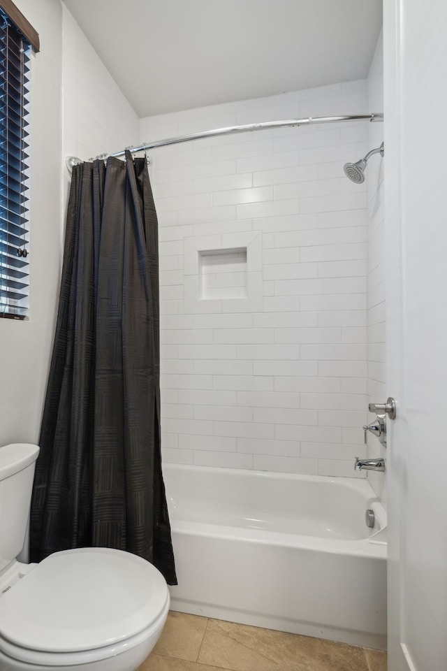 bathroom featuring shower / bath combo, toilet, and tile patterned floors