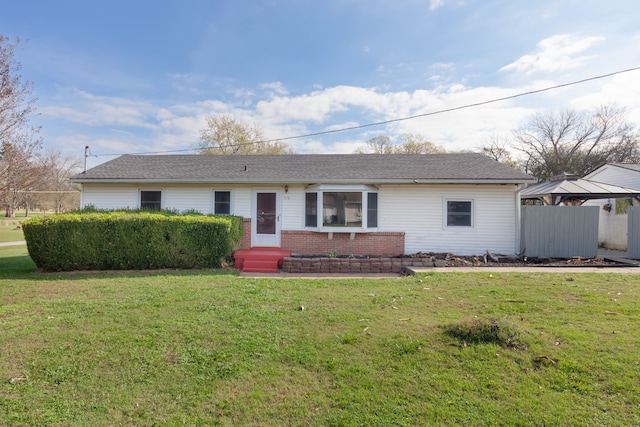 ranch-style home with a front lawn