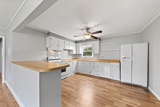 kitchen featuring white cabinetry, sink, light wood-type flooring, white appliances, and ornamental molding