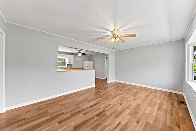 unfurnished living room with light hardwood / wood-style floors