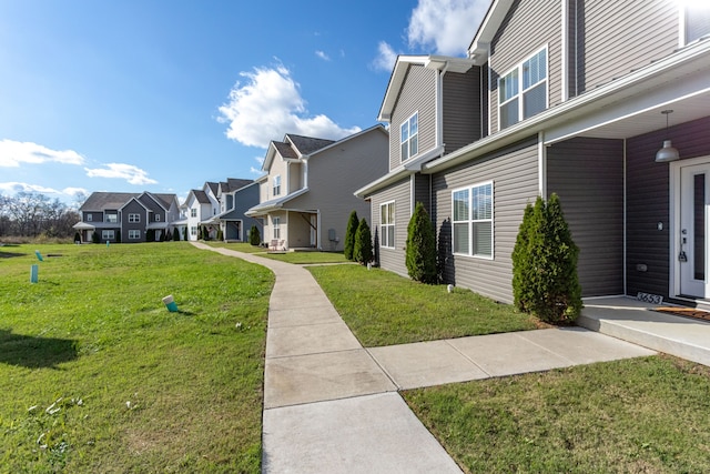 view of property's community featuring a lawn