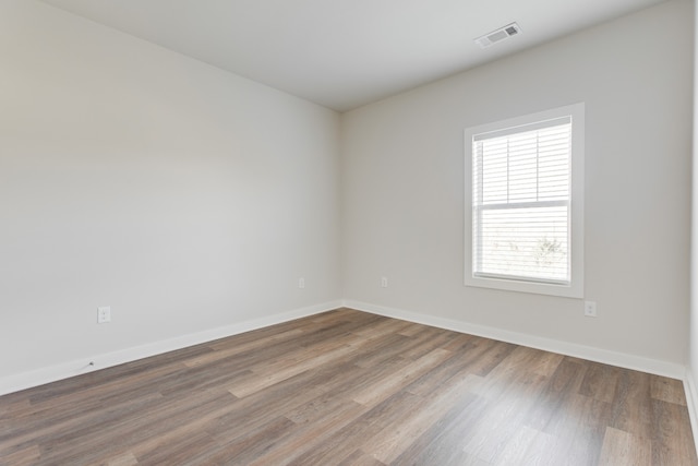 empty room with wood-type flooring