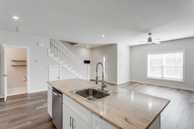 kitchen with dishwasher, sink, dark hardwood / wood-style floors, ceiling fan, and white cabinetry