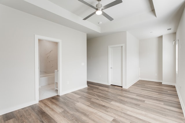 spare room featuring ceiling fan and light hardwood / wood-style flooring