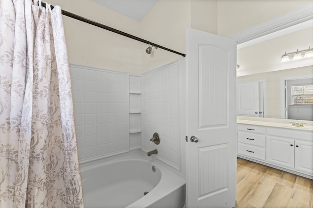 bathroom featuring hardwood / wood-style floors, vanity, and shower / bath combo with shower curtain