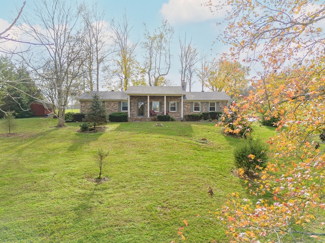 ranch-style house featuring a front lawn