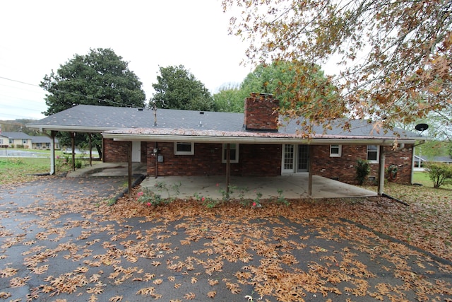 rear view of property featuring a patio area