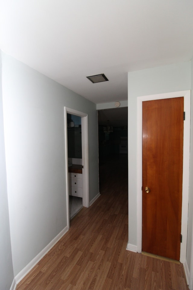 hall with dark hardwood / wood-style floors