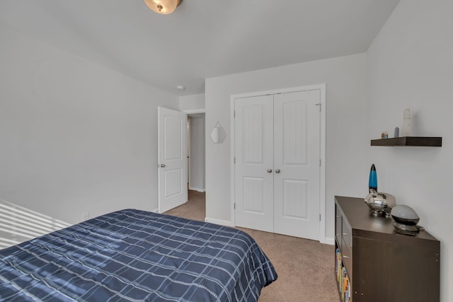 bedroom with a closet and carpet floors