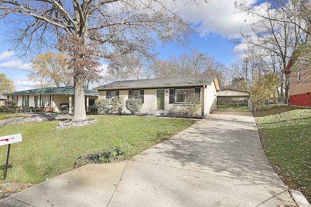 view of front of property with a front yard and a carport