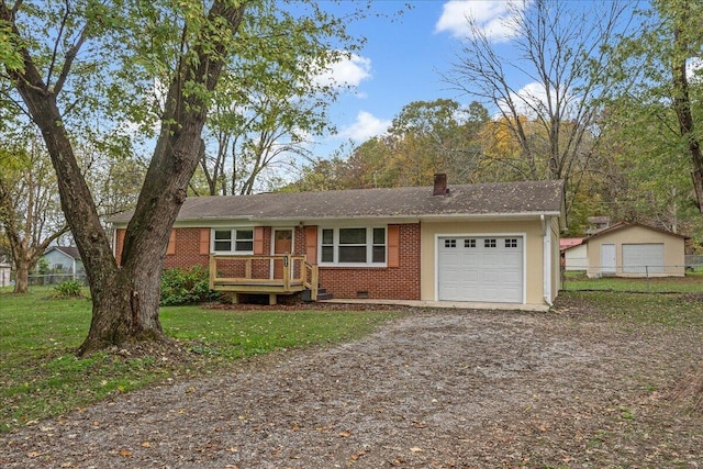 ranch-style home featuring a garage and a front lawn