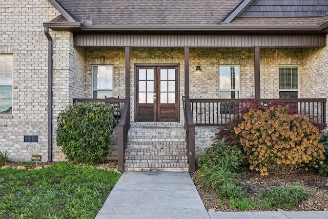 entrance to property featuring french doors and a porch