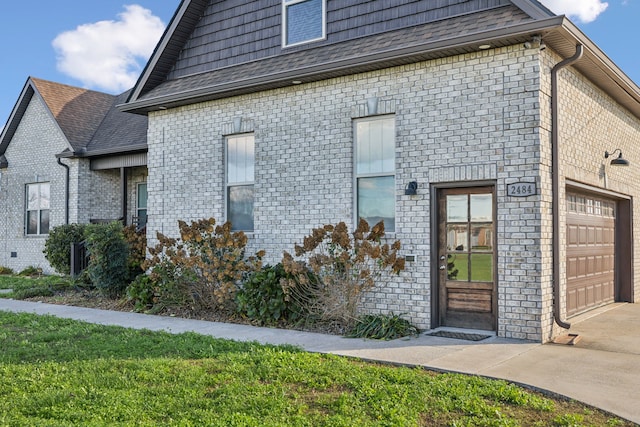 exterior space with a lawn and a garage