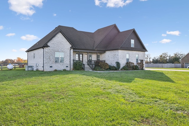 view of front facade with central AC and a front lawn