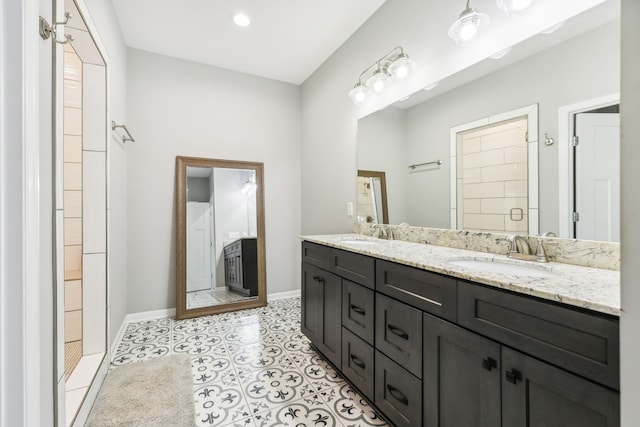 bathroom with vanity, tile patterned floors, and walk in shower