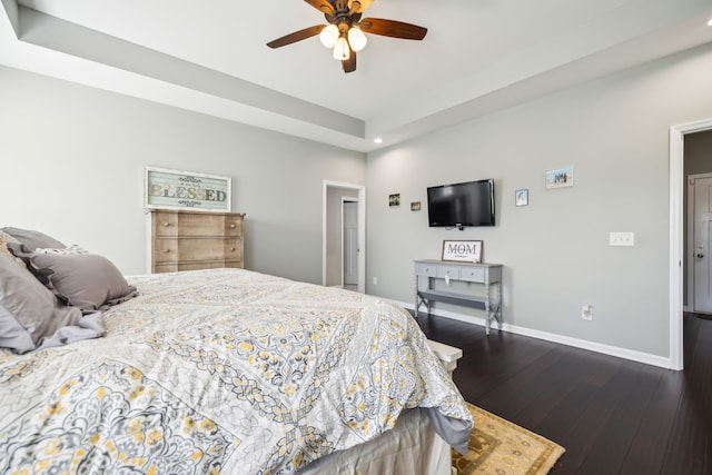 bedroom featuring ceiling fan and dark hardwood / wood-style flooring