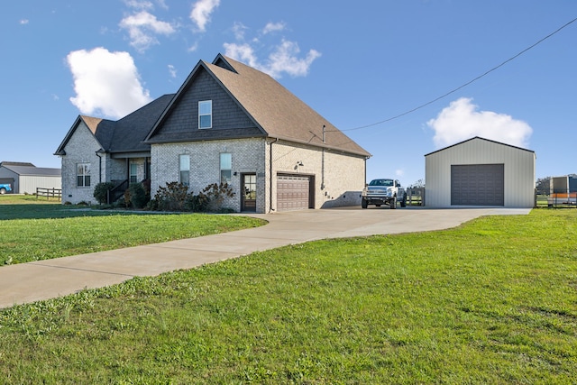 view of front of home featuring a front yard and a garage