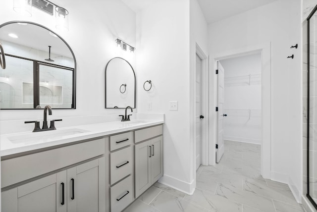 bathroom featuring vanity and an enclosed shower