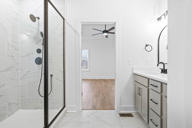 bathroom featuring vanity, ceiling fan, and walk in shower