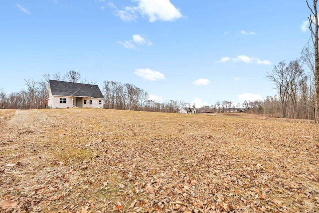 view of yard with a rural view