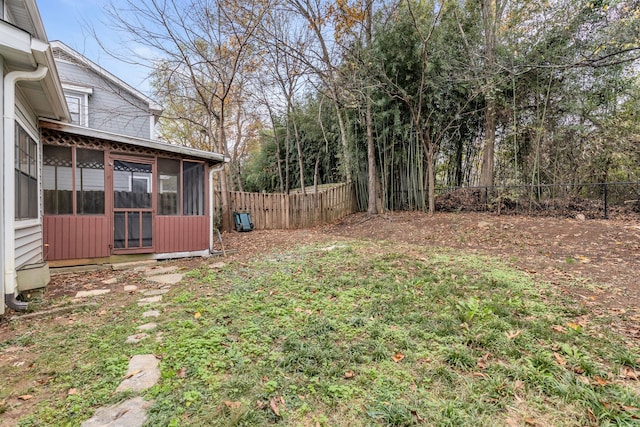 view of yard featuring a sunroom