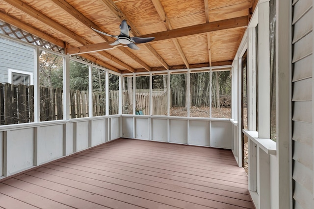 unfurnished sunroom with ceiling fan and lofted ceiling