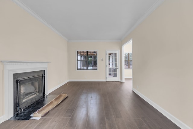 unfurnished living room with dark hardwood / wood-style flooring and ornamental molding