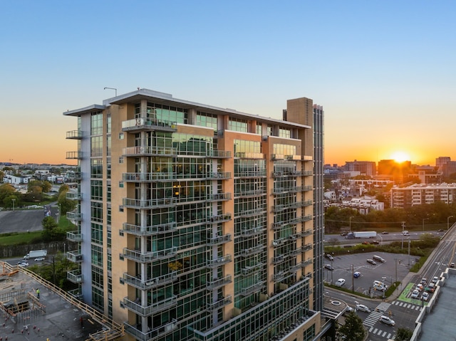 view of outdoor building at dusk